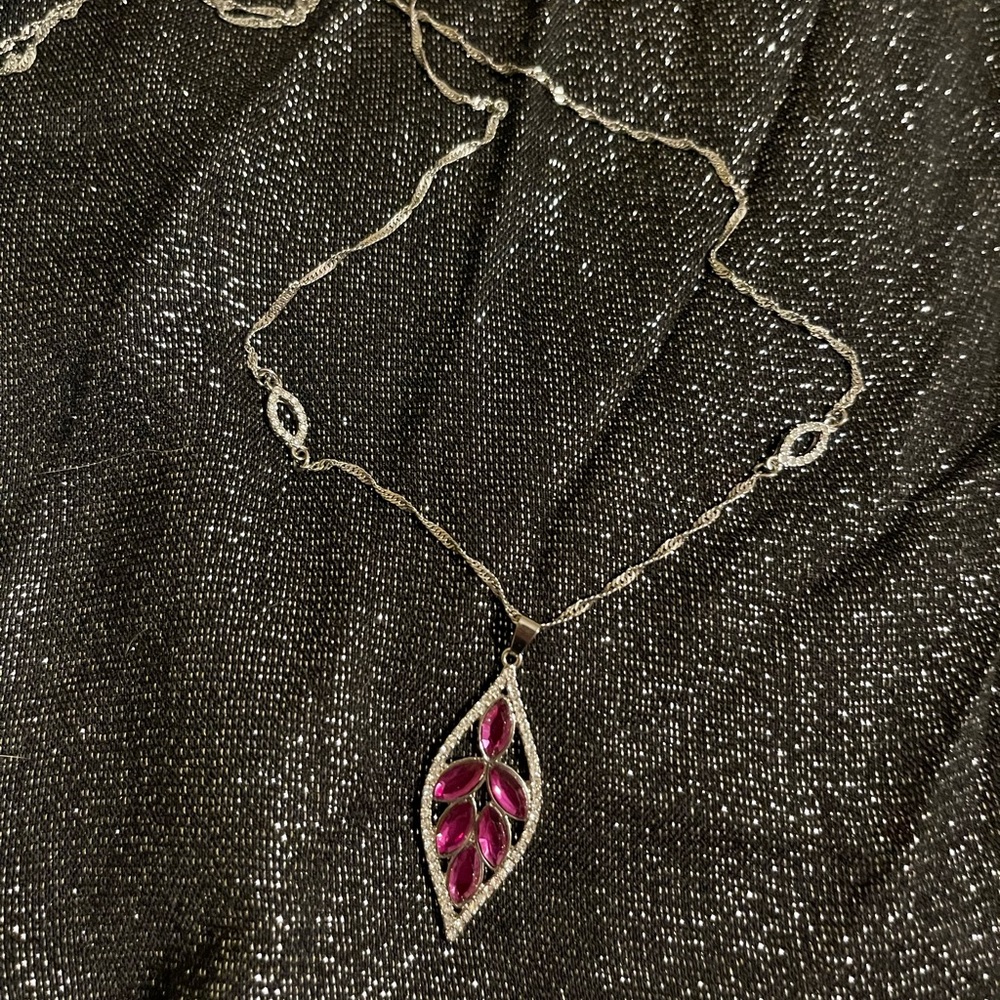 Pretty, long necklace.  Fuschia-coloured, leaf-shaped, pendant.